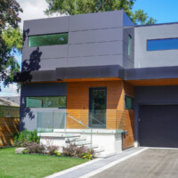 Modern Home, with dark and wood panels, front entrance