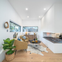 Small sitting room with built in fireplace into hald a wall