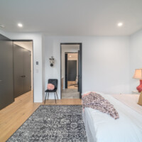 View of bathroom and hallway from a bedroom