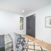 Bedroom with small peakabook window