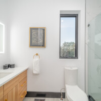 Small modern bathroom with peakaboo window